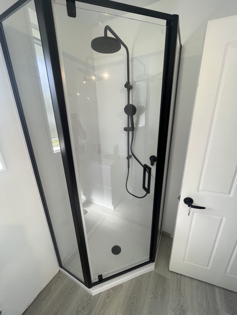 Modern black-framed glass shower
